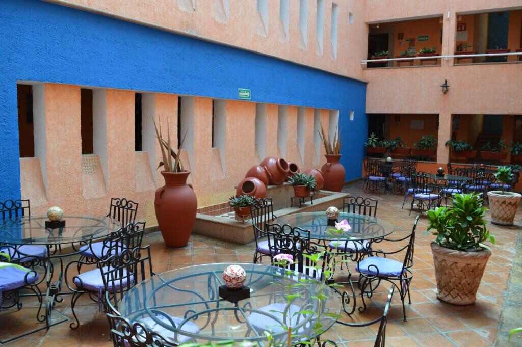 Open-air courtyard with tables and plants